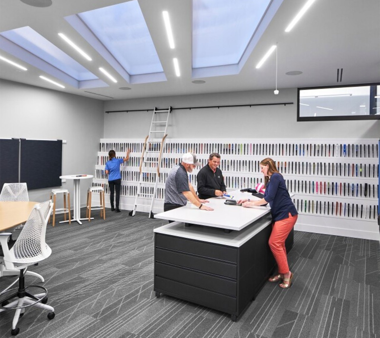 Golf Pride employees reviewing new grips