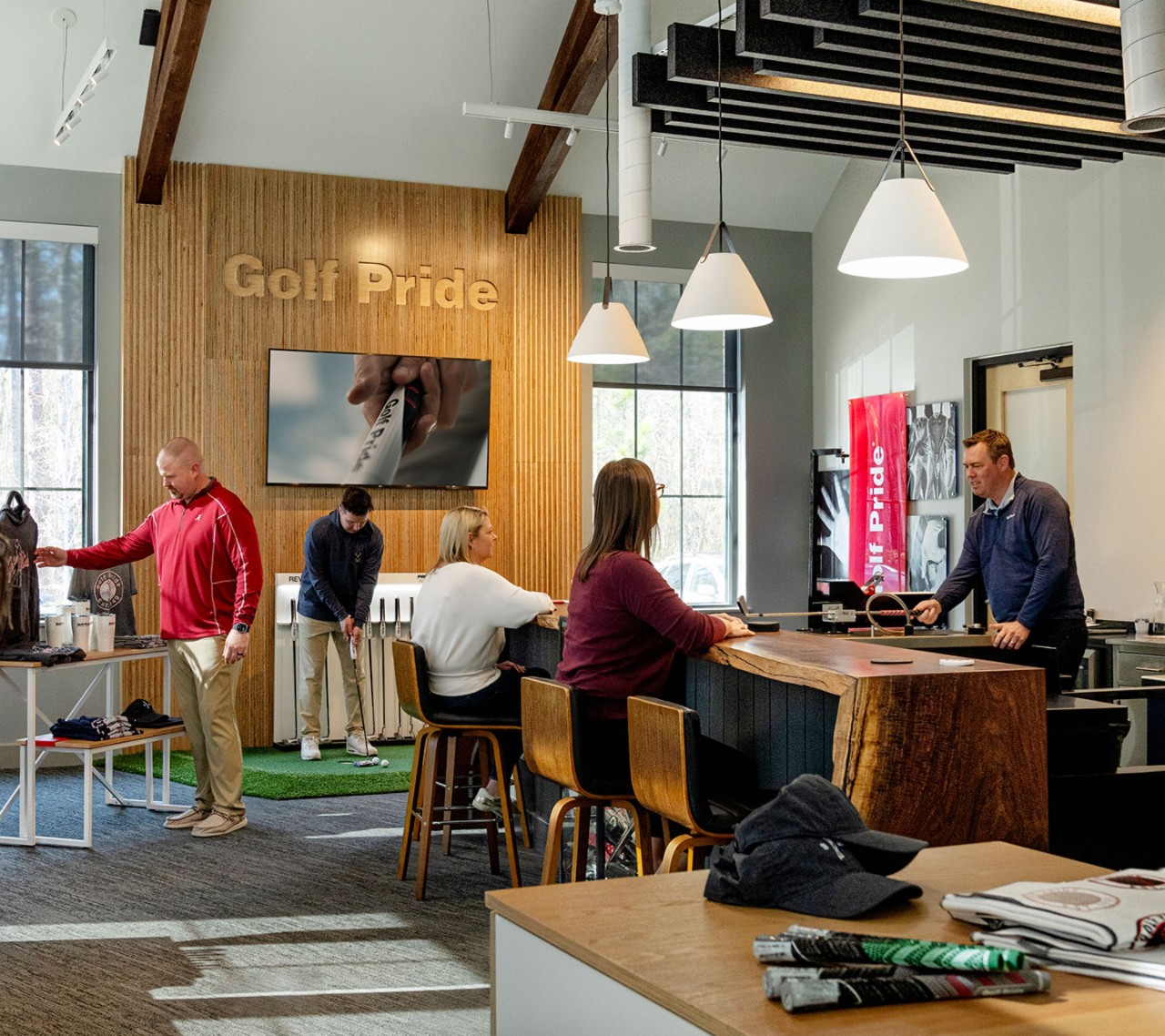 people shopping in the golf pride retail lab